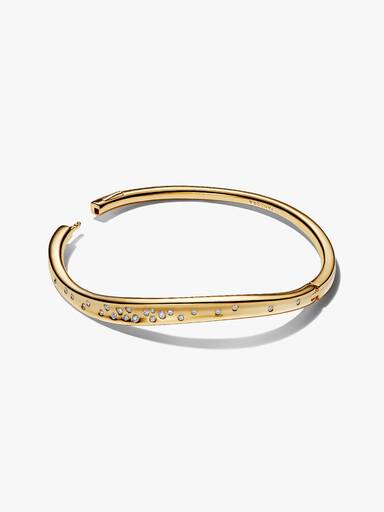 Brazalete rígido con forma orgánica y piedras