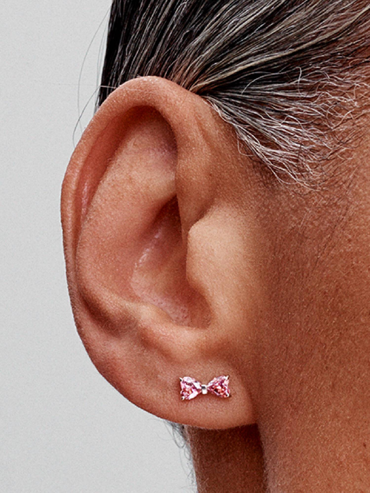 Aros de botón lazo rosa brillante